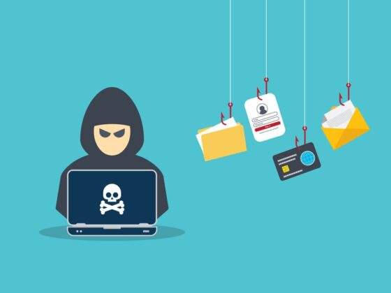Hacker with laptop computer stealing confidential data, personal information and credit card detail. Hacking concept.